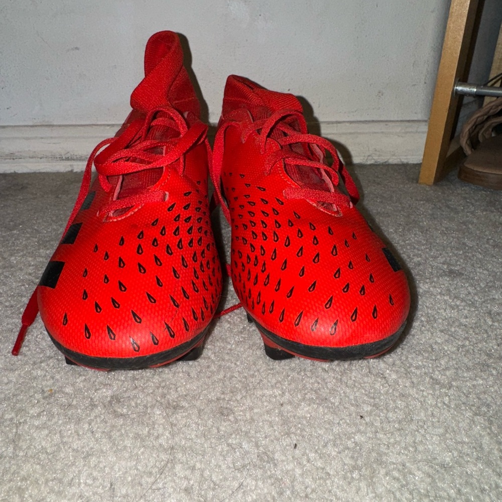 Red and black Adidas predator turf cleats US women’s 8